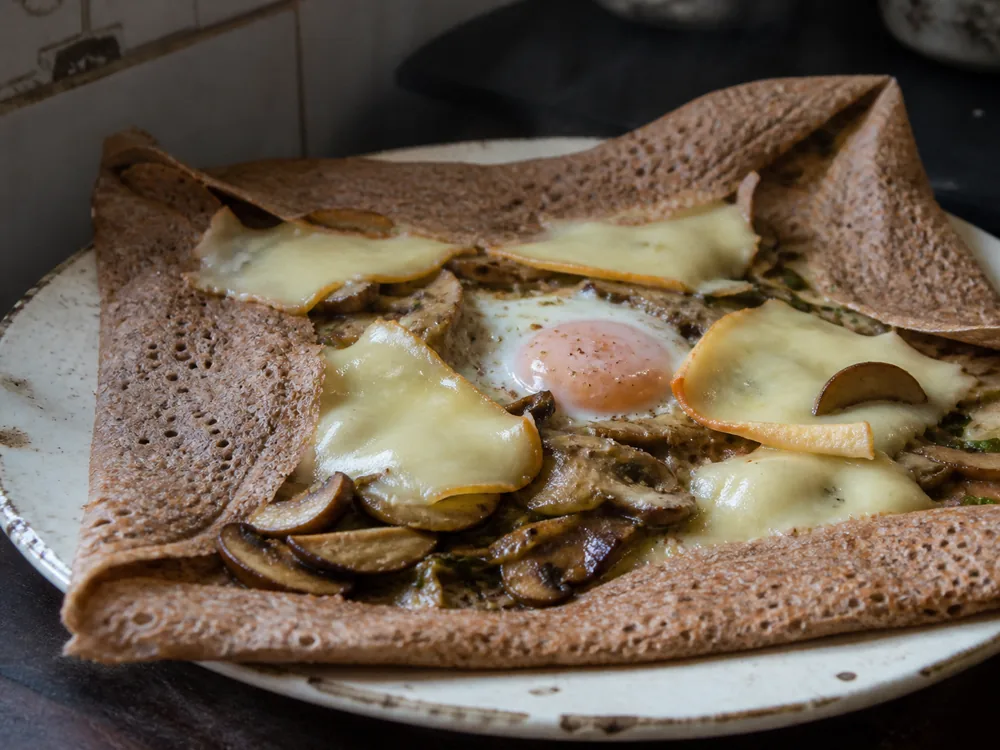 Timadeuc-style cheese melted gently in a buckwheat galette - Abbaye de Timadeuc | KnowTheCheese