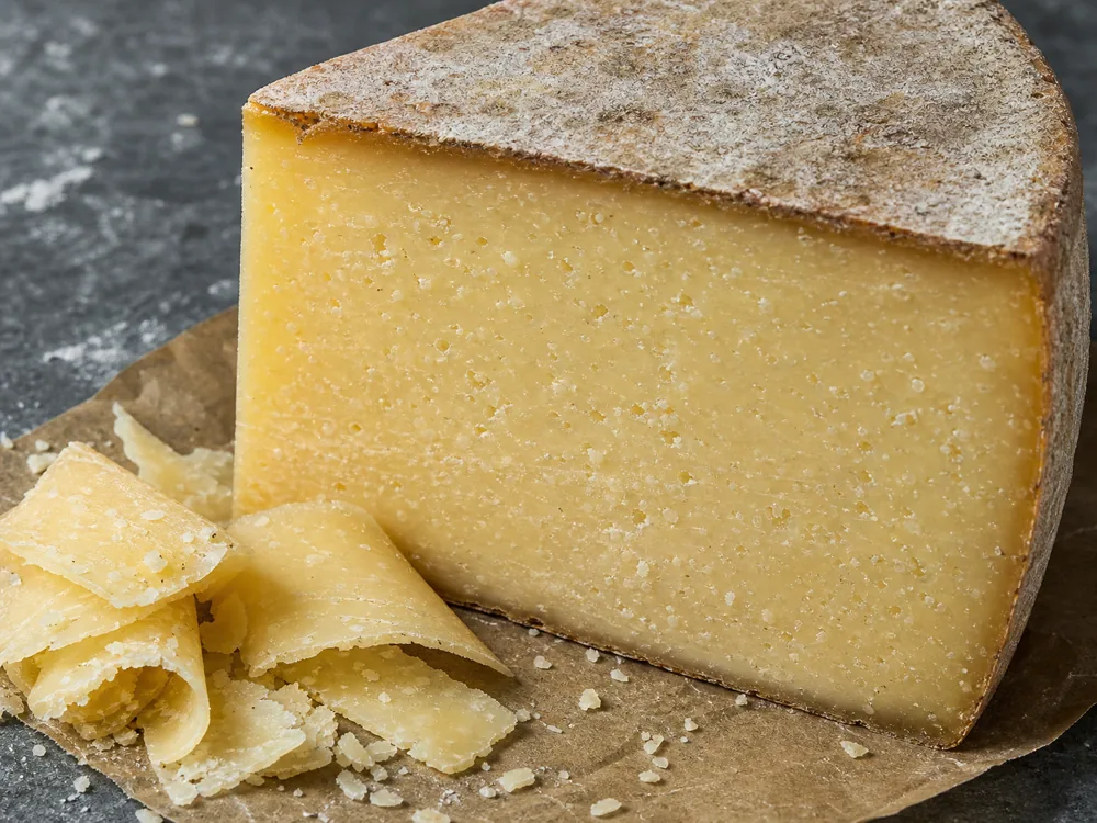 Dense cut face and rind on an Alpe di Frabosa-style mountain cheese wedge - Alpe di Frabosa | KnowTheCheese