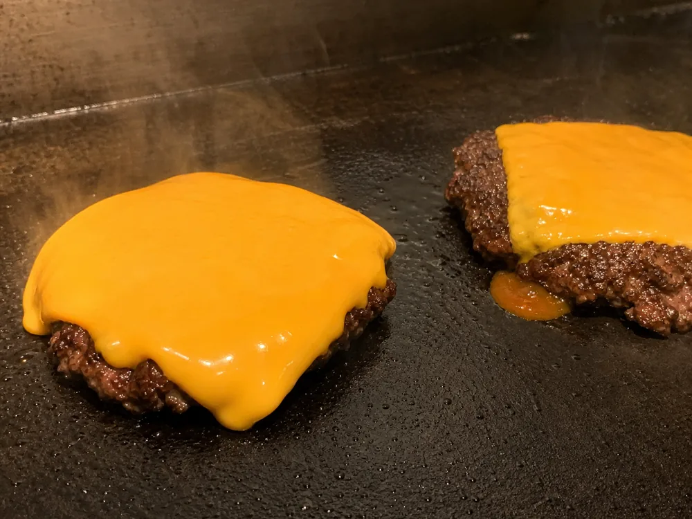 American cheese melting smoothly beside cheddar beginning to separate - American cheese | KnowTheCheese