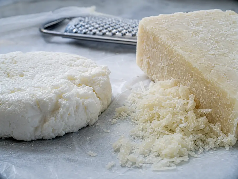 Fresh soft Anari beside hard dry grated Anari - Anari | KnowTheCheese