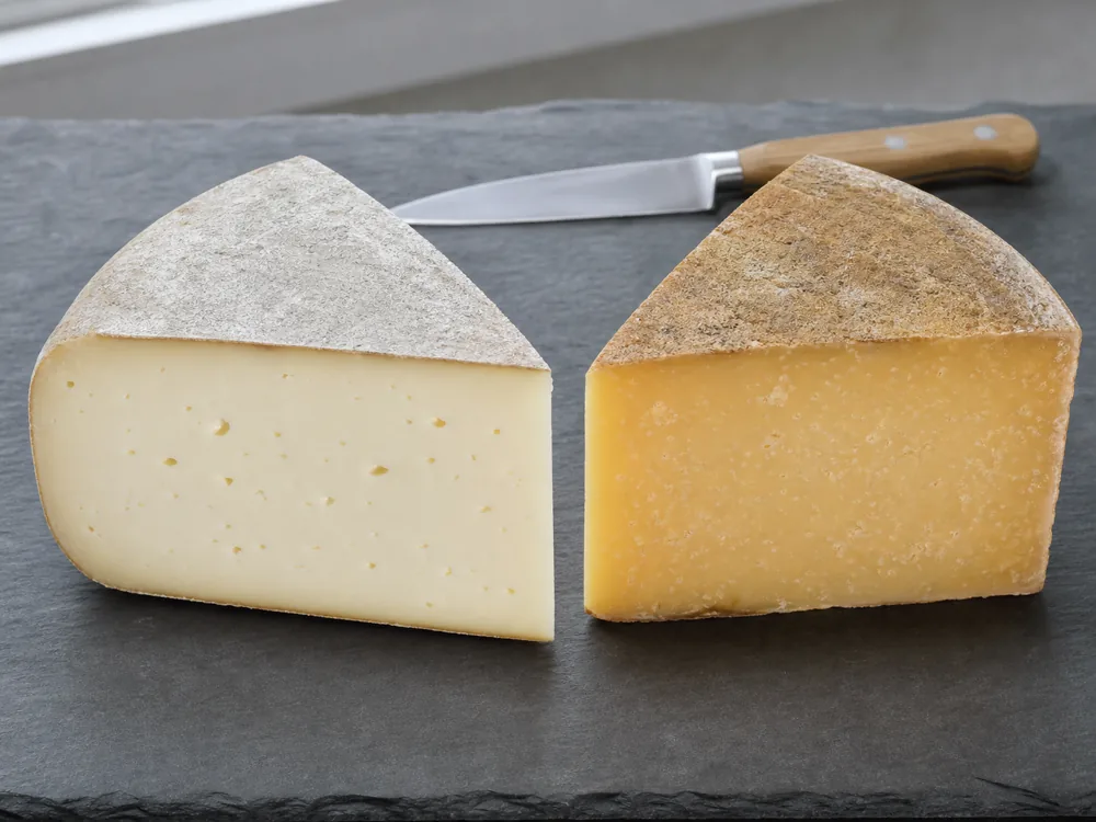 Pale Bra Tenero style wedge beside aged Bra Duro style cheese