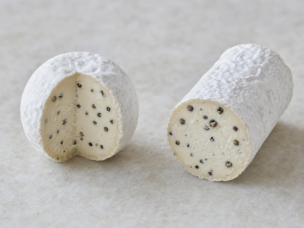 Round and log forms of peppercorn-studded Bridgewater cheese