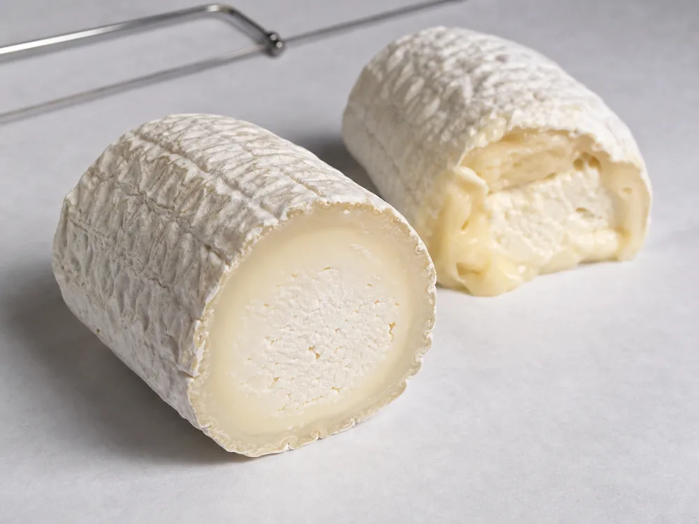 Mid-ripe Bucheron cut compared with a softer collapsed overripe cut - Bucheron cheese | KnowTheCheese