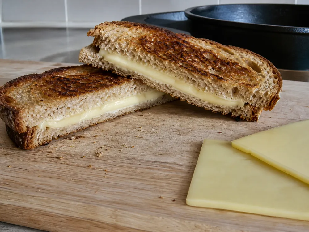 Butterkase melting smoothly inside a grilled sandwich - Butterkase Cheese | KnowTheCheese