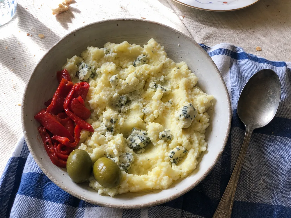 Mashed potatoes folded with small pieces of Buttermilk Blue Affinee - Buttermilk Blue Affinee | KnowTheCheese