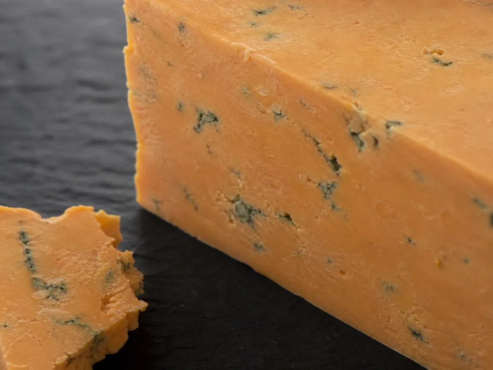 Muted russet paste with fine blue veins - Buxton Blue | KnowTheCheese