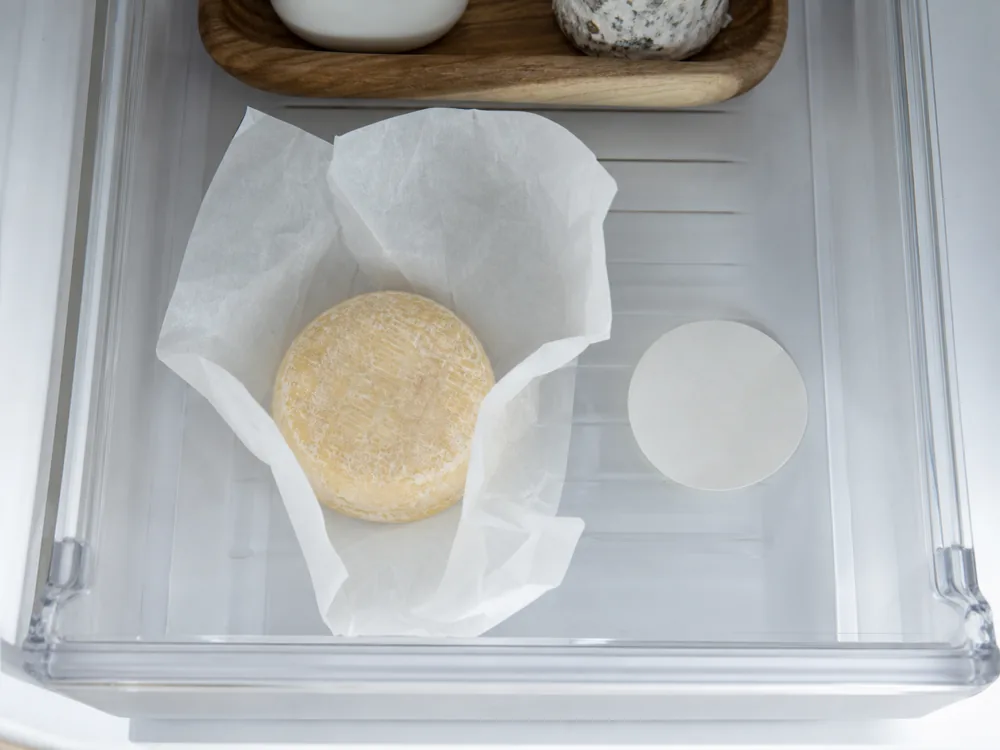 Small goat cheese discs wrapped separately in cheese paper - Cabécou | KnowTheCheese