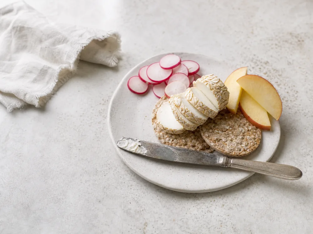 Thin Caboc slices served on oatcakes with apple and radish | KnowTheCheese