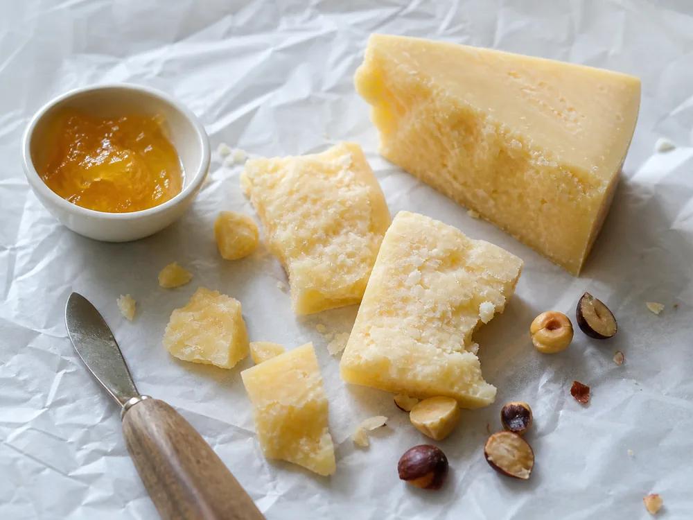 Irregular clothbound cheddar shards with apple jelly and toasted nuts | KnowTheCheese