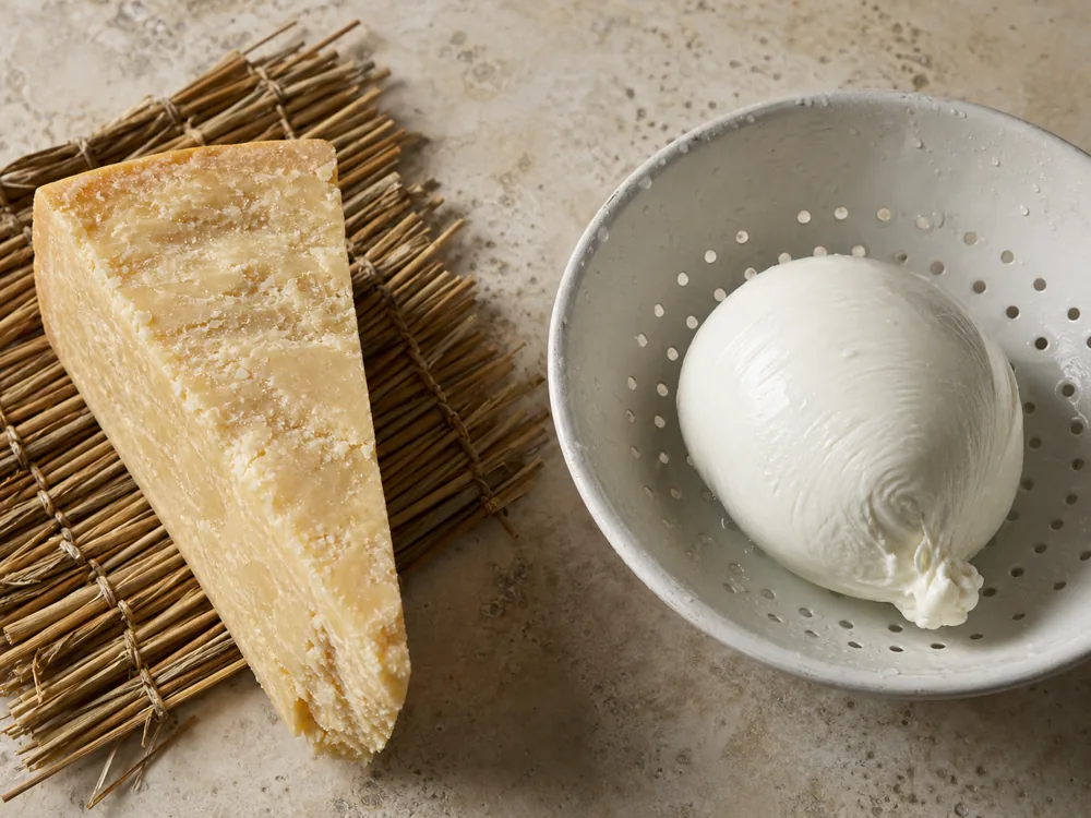 Aged Caciobufala wedge beside fresh buffalo mozzarella showing the moisture difference | KnowTheCheese