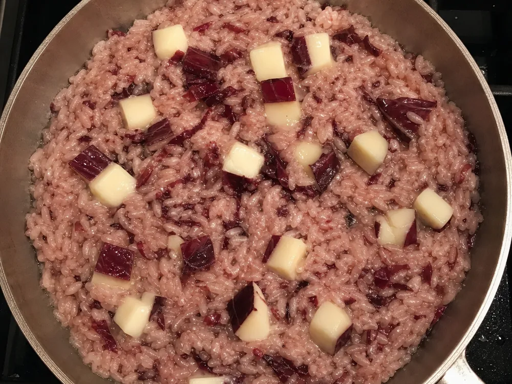 Cacioradicchio melting into a pan of radicchio risotto | KnowTheCheese
