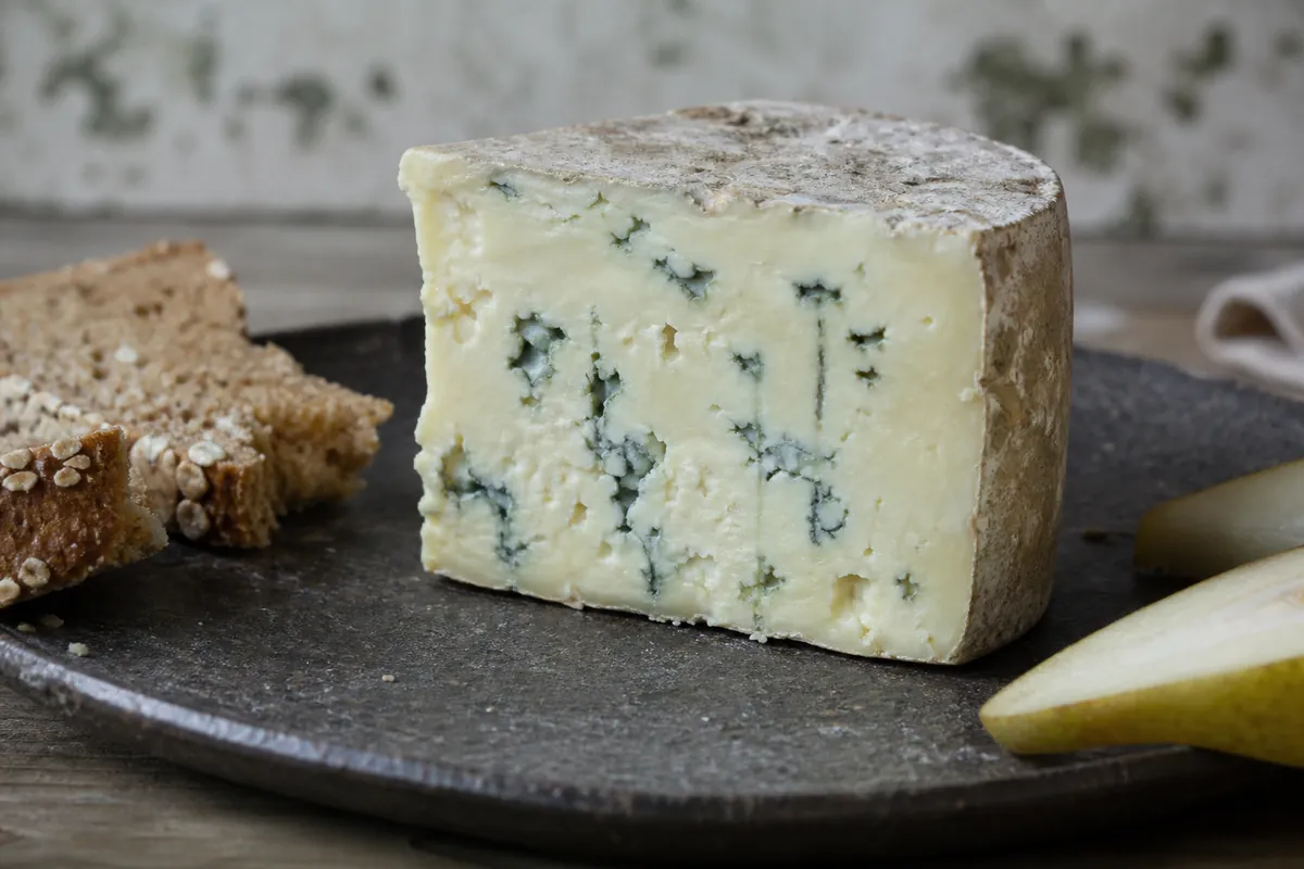 Creamy Irish blue cheese wedge with gentle blue-green marbling - Cashel Blue | KnowTheCheese