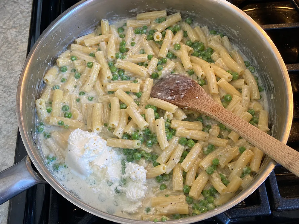 Peas and pasta coated in a light fresh goat cheese sauce | KnowTheCheese