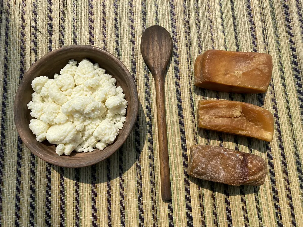 Moist soft chhurpi beside dense dried hard chhurpi pieces | KnowTheCheese