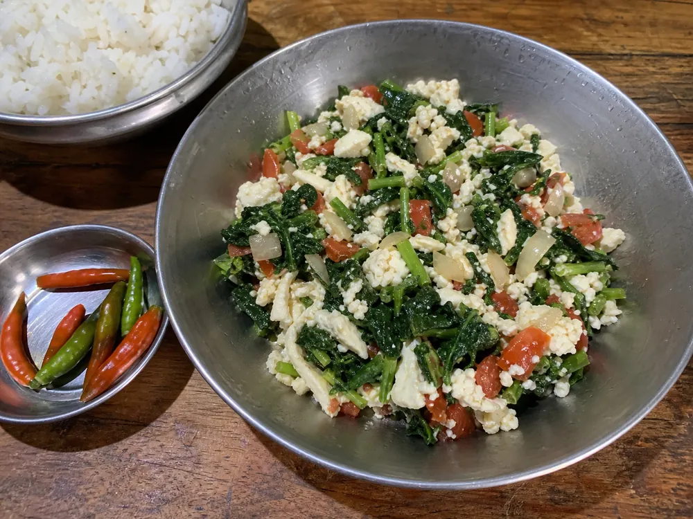Soft chhurpi curds cooked with leafy greens and tomato | KnowTheCheese