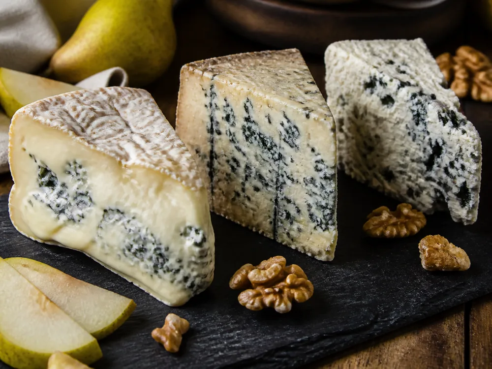 Blue cheese intensity lineup from creamy Gorgonzola Dolce to firmer blue and crumbly Roquefort - Gorgonzola vs Roquefort | KnowTheCheese