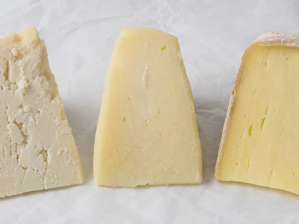 Cotherstone wedges showing a change from flaky center to smoother mature paste