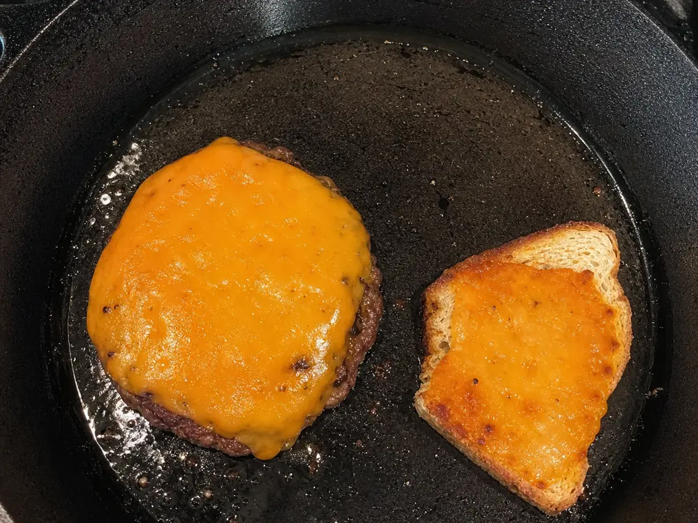 Cotswold melted over a burger with a separate browned toast test