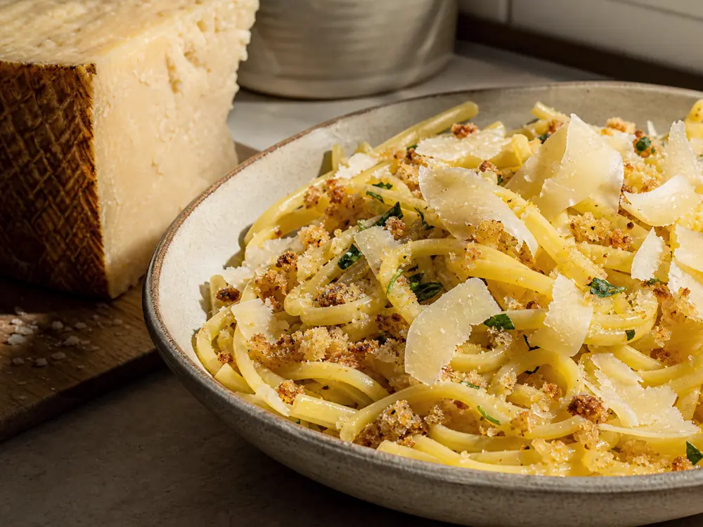 Coarse aged sheep cheese curls over warm pasta with breadcrumbs - Pecorino Crotonese | KnowTheCheese