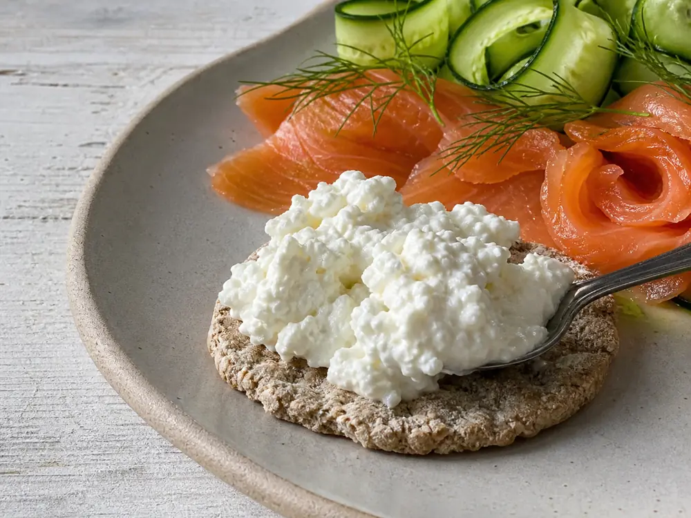 Crowdie on an oatcake with smoked fish cucumber and dill - Crowdie cheese | KnowTheCheese