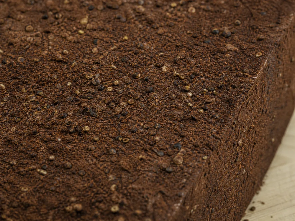 Close-up of the dark pressed cocoa-and-pepper rind on Dry Jack cheese - Dry Jack cheese | KnowTheCheese