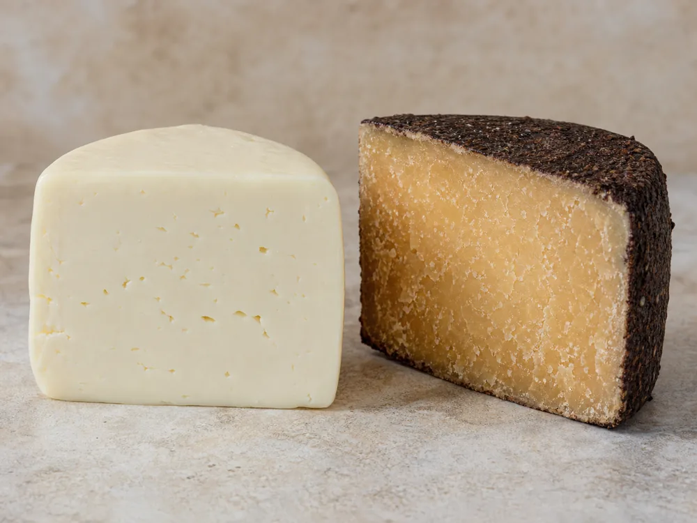Fresh Monterey Jack block beside a hard aged Dry Jack wedge - Dry Jack cheese | KnowTheCheese