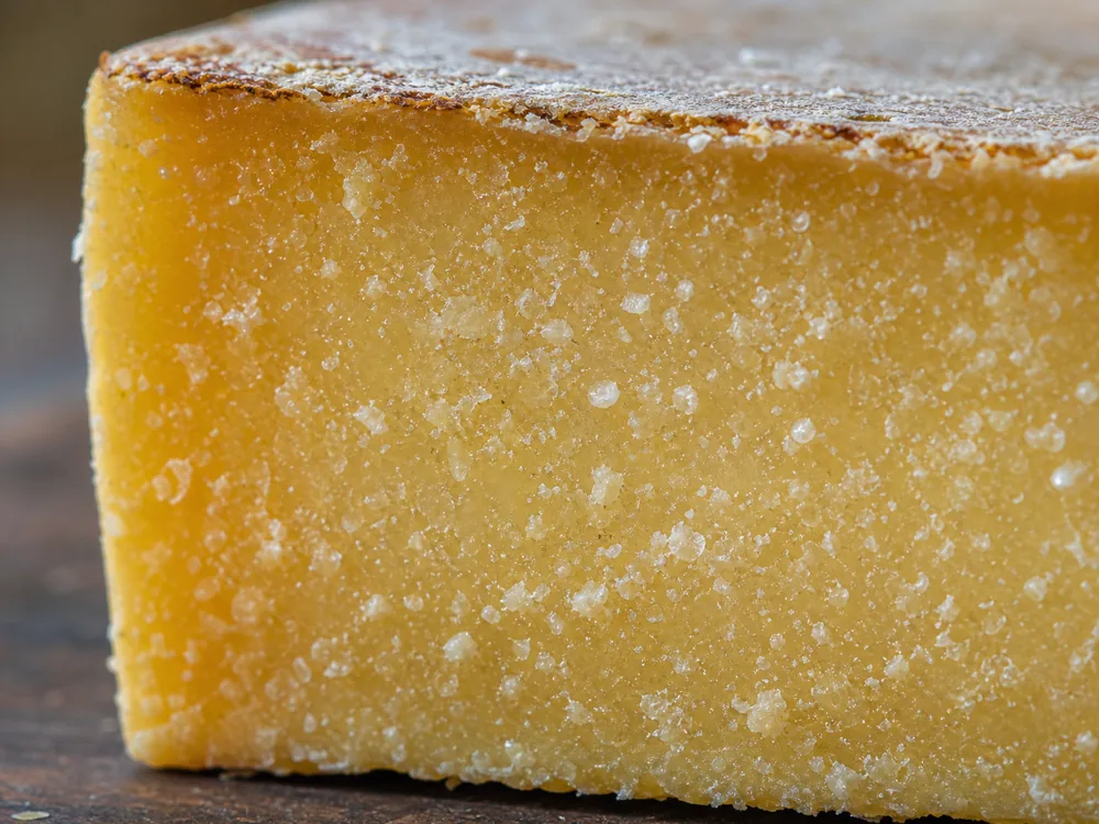 Close-up of white calcium lactate crystals on aged Dry Jack cheese - Dry Jack cheese | KnowTheCheese