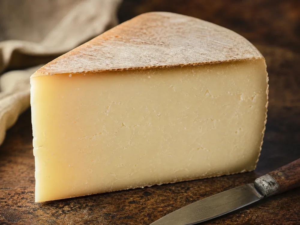 Close-up of the smooth fudgy cut face of Dunlop cheese - Dunlop cheese | KnowTheCheese