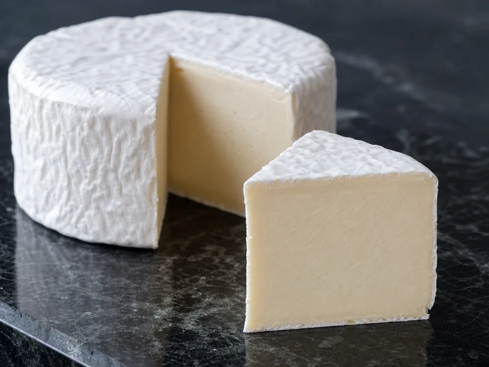 Explorateur triple-cream wheel cut open - Explorateur | KnowTheCheese