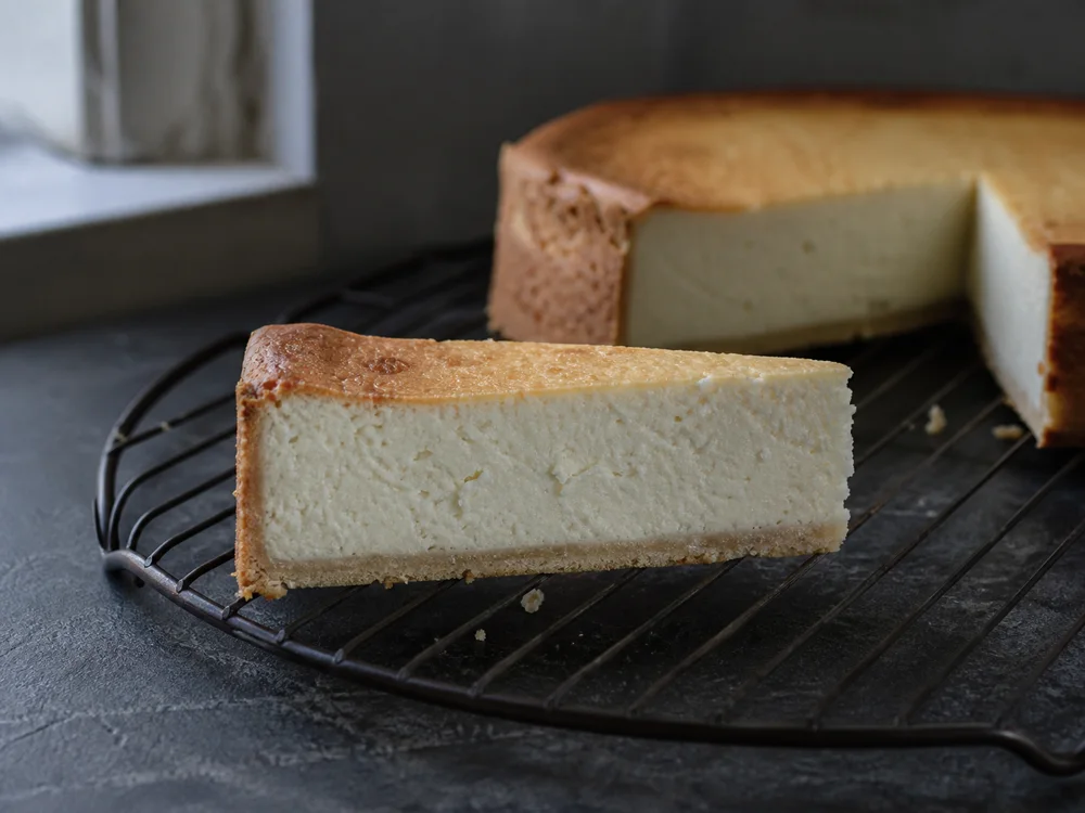 Cut farmer cheese cheesecake showing a firm fine-curded filling - Farmer Cheese | KnowTheCheese