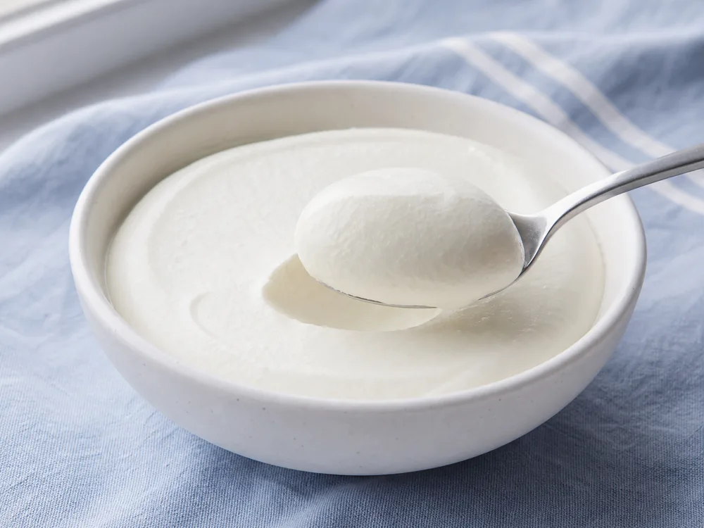 Smooth fromage blanc holding softly on a spoon - Fromage Blanc | KnowTheCheese