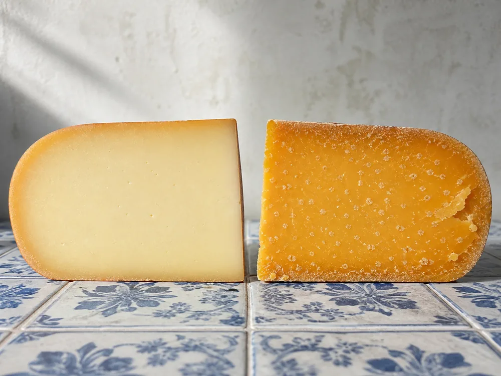 Young and aged Gouda wedges showing color and crystal changes - Gouda | KnowTheCheese