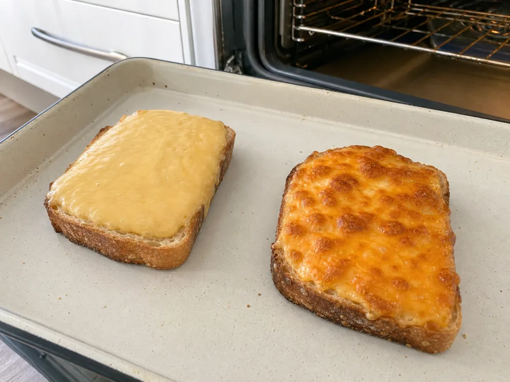 Gouda and Cheddar melted in equal portions on sourdough toast - Gouda vs Cheddar | KnowTheCheese