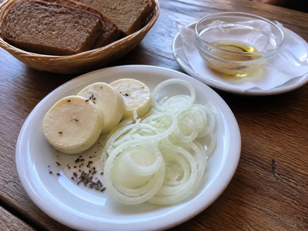 Harzer cheese rounds with onion caraway and rye bread - Harzer cheese | KnowTheCheese