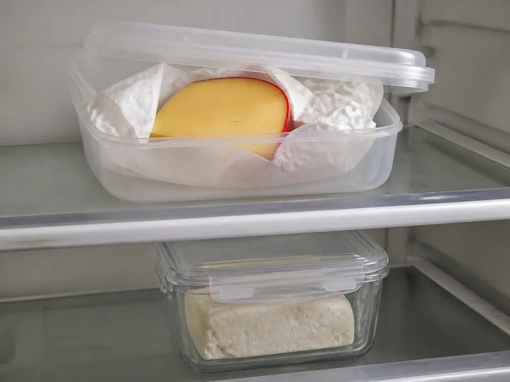 Hoop cheese stored in parchment and pressed dry curd in a sealed container - Hoop cheese | KnowTheCheese