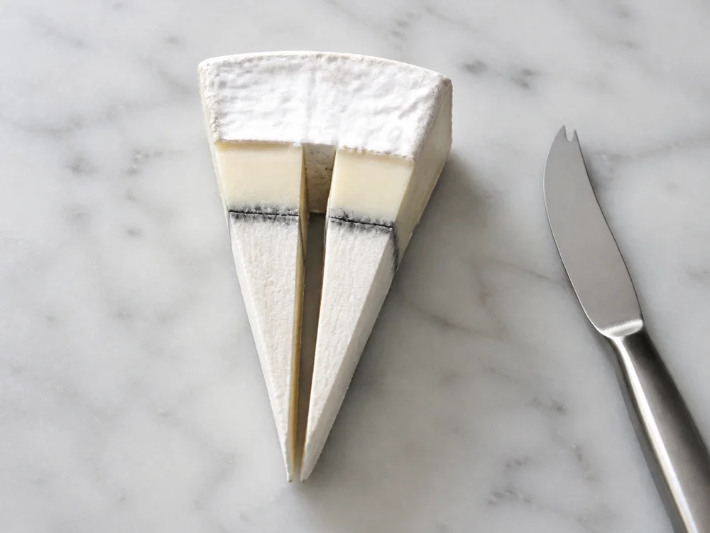 Radial Humboldt Fog portions with rind cream line ash and center - Humboldt Fog cheese | KnowTheCheese