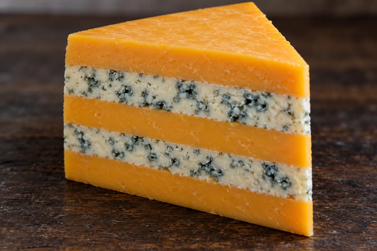 Five-layer Huntsman with orange and blue-veined layers - Huntsman cheese | KnowTheCheese
