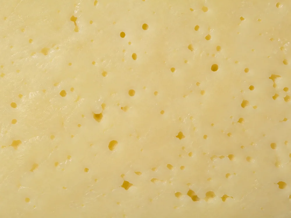 Small irregular holes in pale Hushållsost paste - Hushållsost cheese | KnowTheCheese
