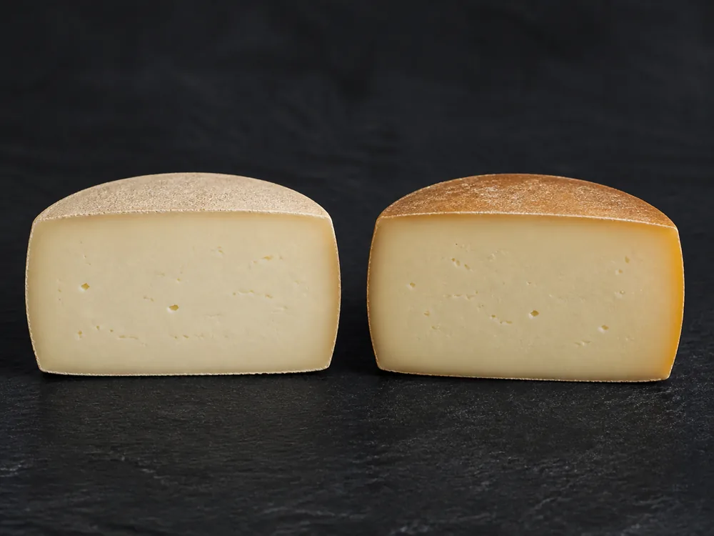 Smoked and unsmoked Idiazabal wedges compared side by side - Idiazabal | KnowTheCheese