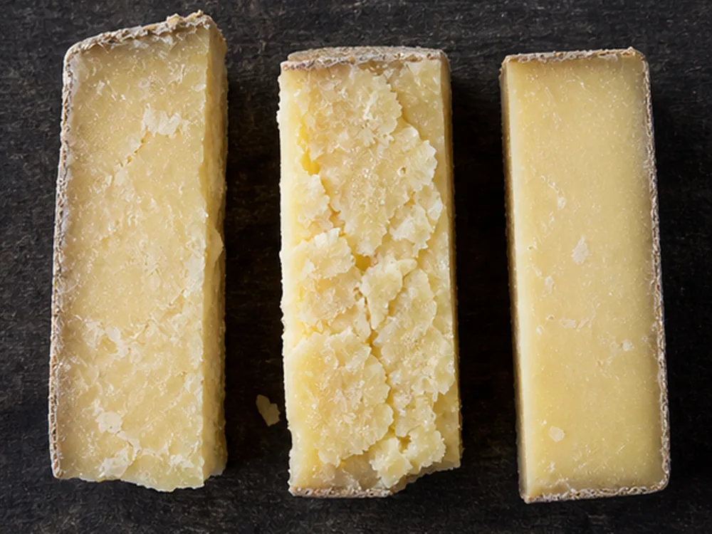 Three Isle of Mull cheddar pieces showing batch texture variation - Isle of Mull cheese | KnowTheCheese
