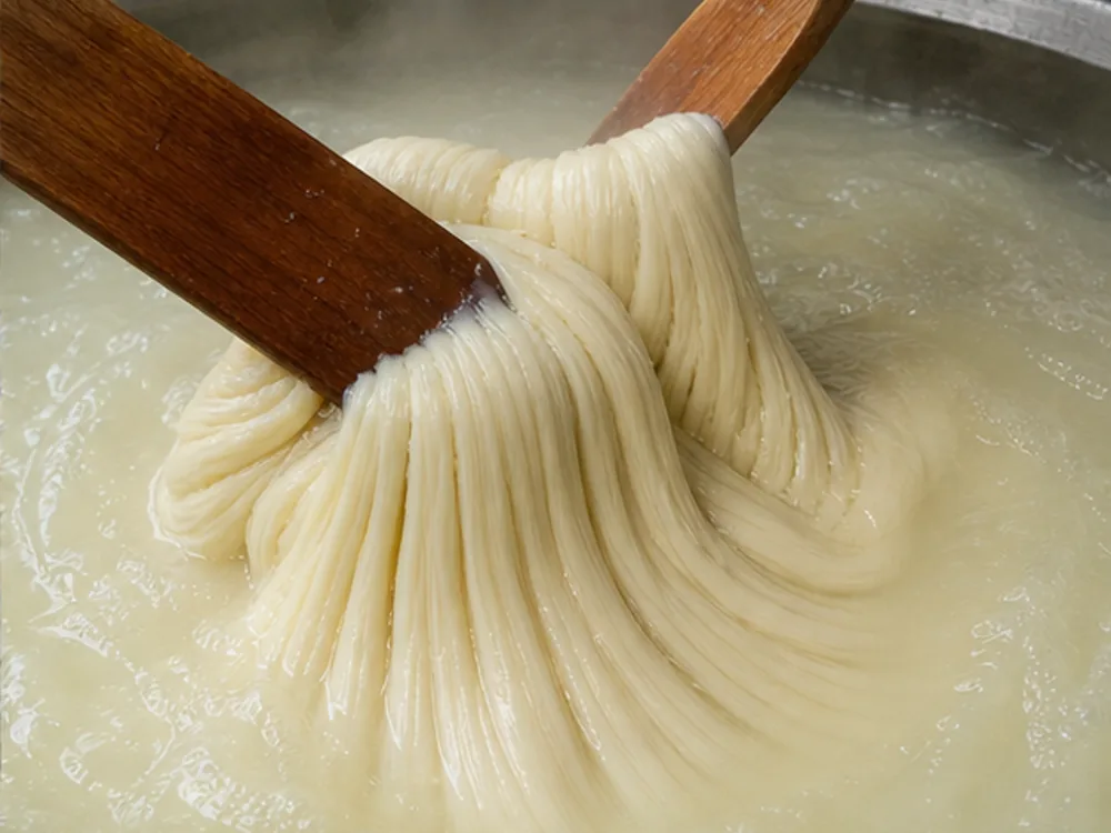 Kaşar curd being kneaded in hot salted water - Kashar cheese | KnowTheCheese
