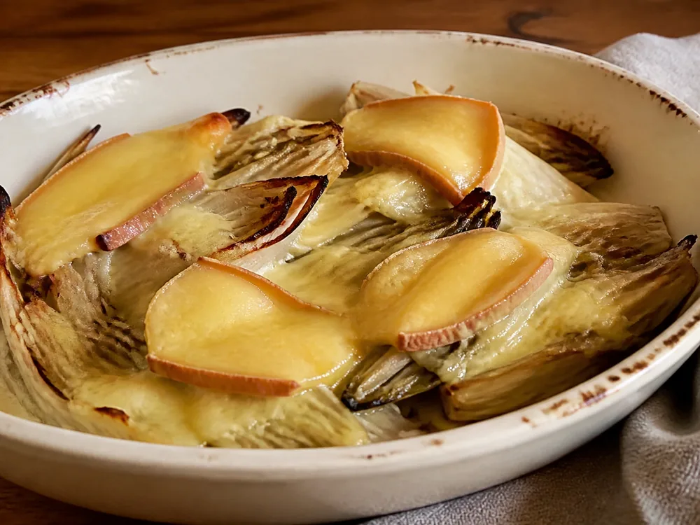 Kernhem-style cheese melted over baked chicory - Kernhem | KnowTheCheese