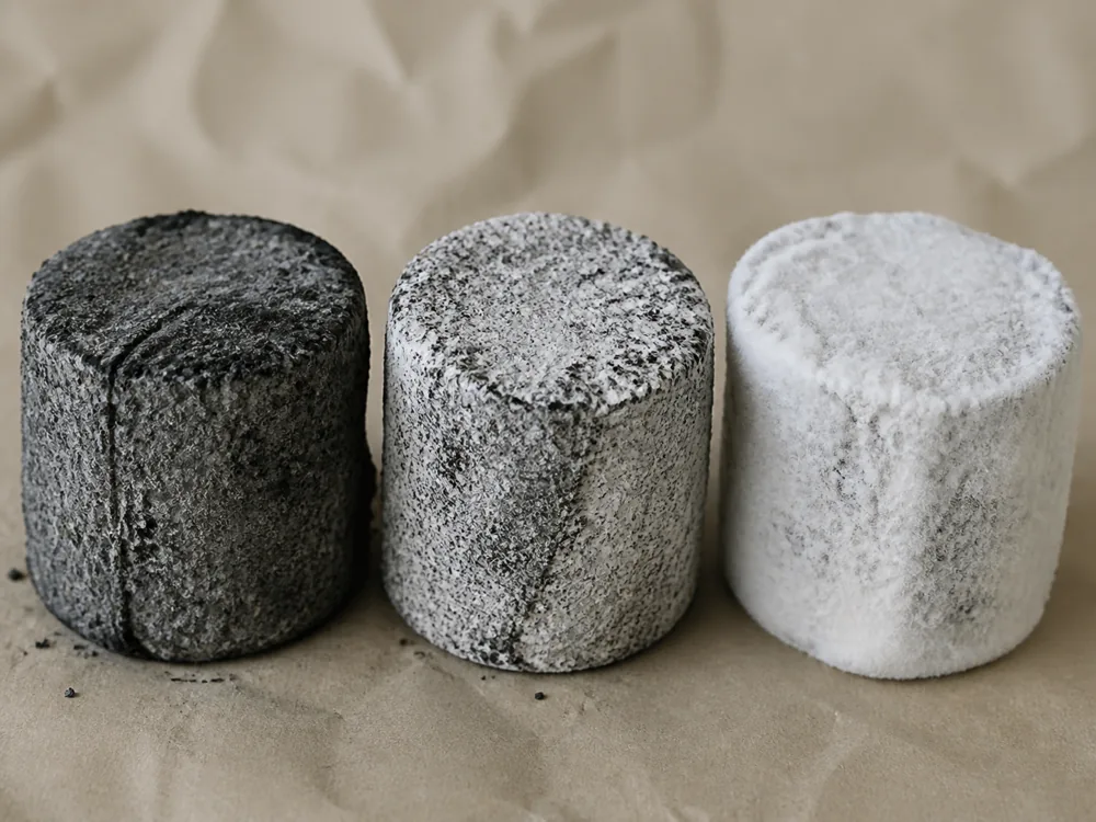 Food ash surface developing a speckled white mould bloom - Kidderton Ash | KnowTheCheese