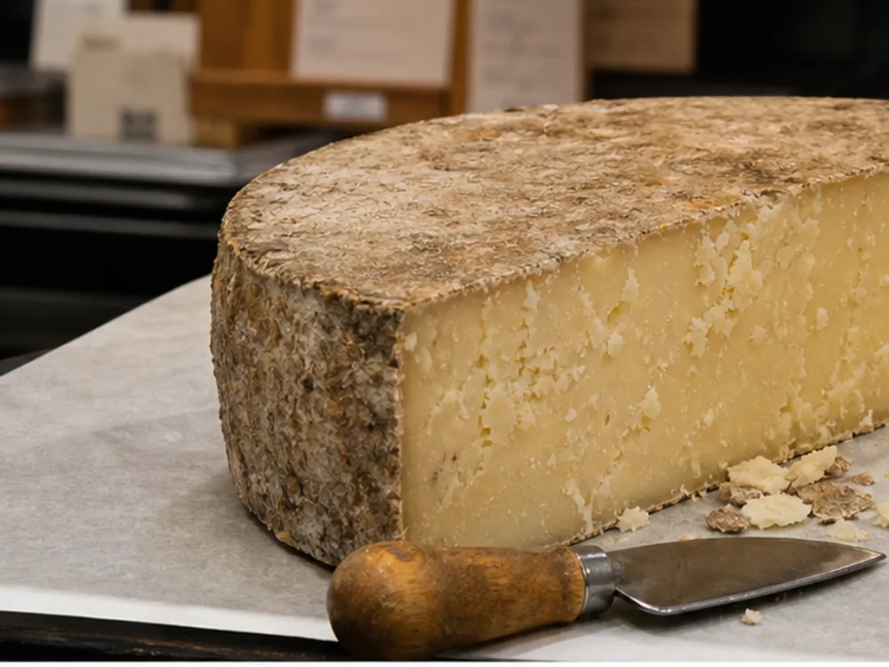Clothbound Lancashire wedge with rind flakes and tasting crumbs - Kirkham's Lancashire | KnowTheCheese