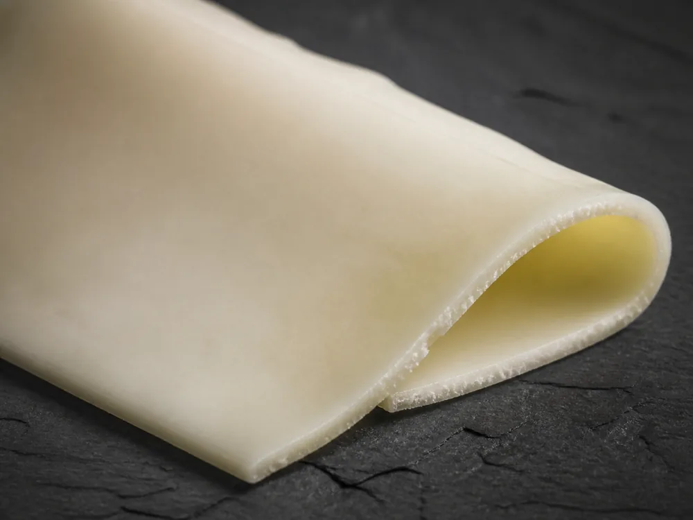 Smooth dense paste in a thin slice of sheep milk cheese - Lamb Chopper | KnowTheCheese