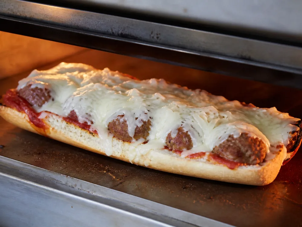 Lamb Chopper melting evenly over a meatball sandwich - Lamb Chopper | KnowTheCheese