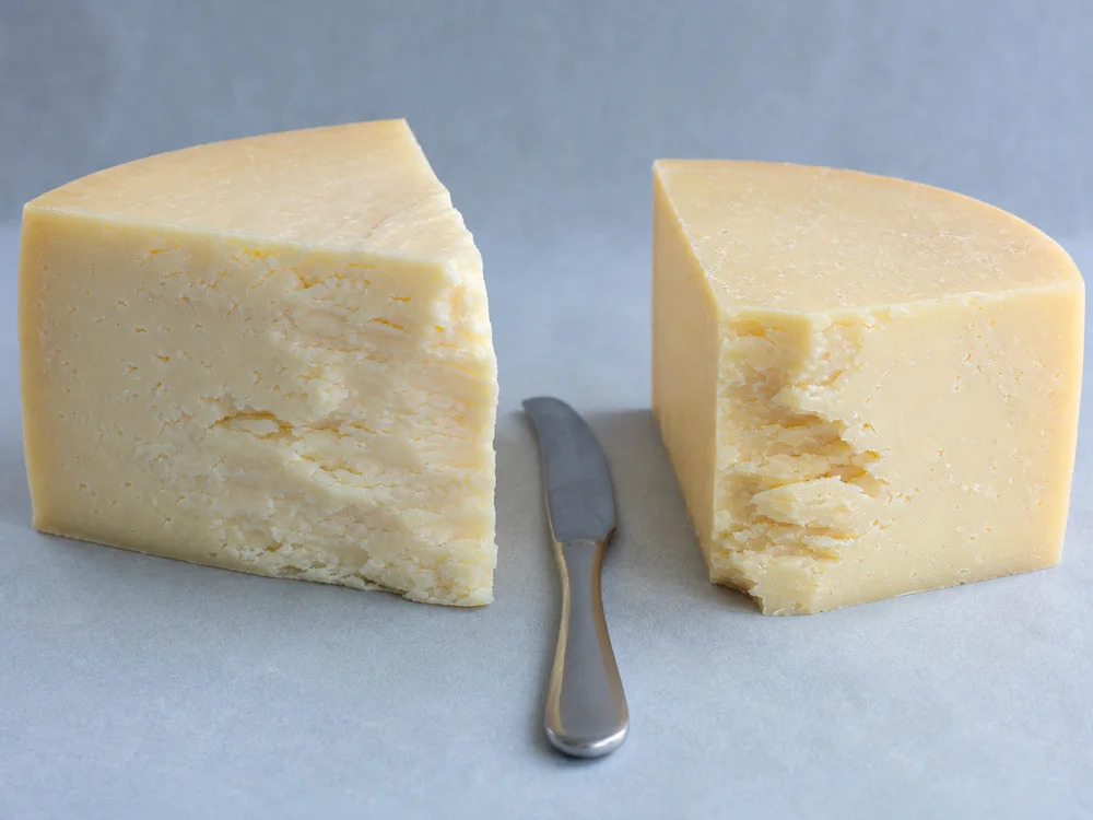 Young and mature Lancashire wedges showing different cut-face textures - Lancashire | KnowTheCheese