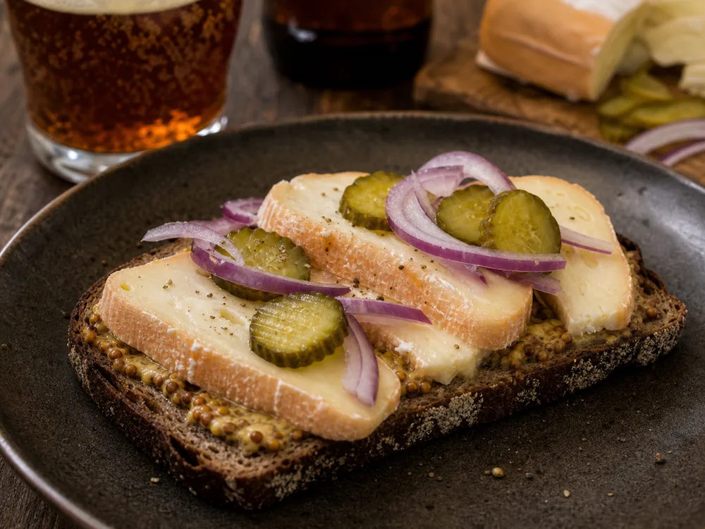 Limburger sandwich with rye onion and mustard - Limburger Cheese | KnowTheCheese
