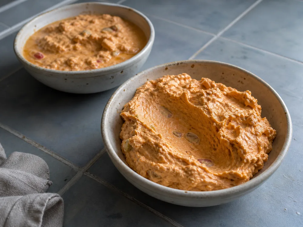 Cohesive rested Liptauer beside a loose separated mixture - Liptauer | KnowTheCheese