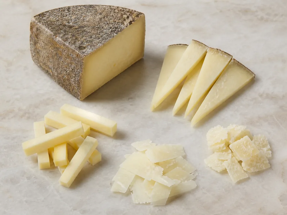Thin wedges, batons, shavings, and flakes cut from firm Marisa cheese - Marisa | KnowTheCheese